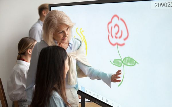 People using an interactive whiteboard